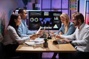 Business professionals collaborating using integrated customer data management systems